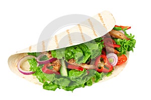 Tortilla wrap with fried chicken meat and vegetables isolated on white background. fast food