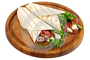 Tortilla wrap with fried chicken meat and vegetables on wooden board isolated on white background
