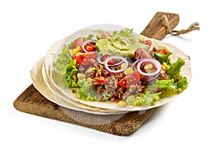 Tortilla wrap with fried minced meat and vegetables