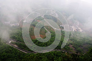 Tortuous road in the fog