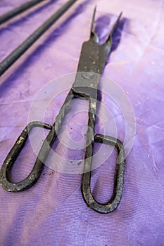 Iron tongs torture