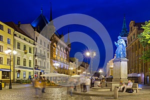 Torun Town Hall and statue of Copernicus in evening