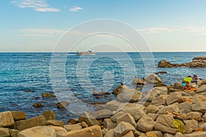 TOSSA DE MAR, CATALONIA, SPAIN: A beautiful small beach between the mountains with rocks near the fortress