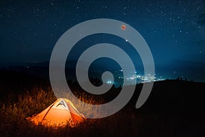 Total moon eclipse in a night starry sky