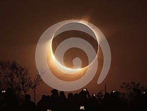 Total solar eclipse. Crowd of people watching annular solar eclipse