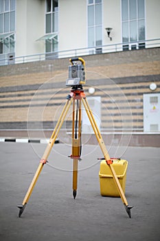 Total Station on pavement in front of a