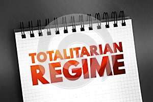 Totalitarian Regime - form of government and political system that prohibits all opposition parties, text concept on notepad