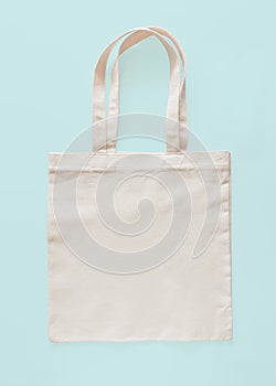 Tote bag canvas fabric cloth eco shopping sack mockup blank template isolated on pastel blue background clipping path