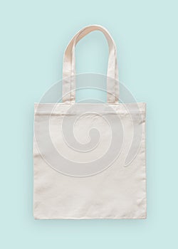 Tote bag canvas fabric cloth eco shopping sack mockup blank template isolated on pastel mint blue background clipping path