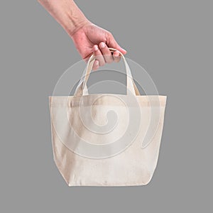 Tote bag canvas white cotton fabric cloth for eco shoulder shopping sack mockup blank template isolated on grey background