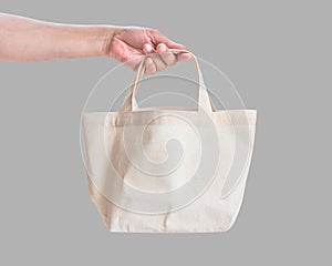 Tote bag canvas white cotton fabric cloth for eco shoulder shopping sack mockup blank template isolated on grey background