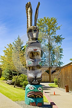 Totem pole with eagle on top, totem pole of canadian indians