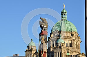 Totem Pole In Front of B.C. Legislature Building photo