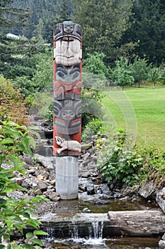 Totem Pole in the village of Hoonah at Icy Strait Point in Alaska photo