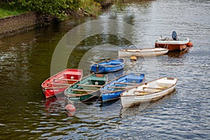 Waterlogged rowing boats moored on the River Dart near Totnes on July 29, 2012