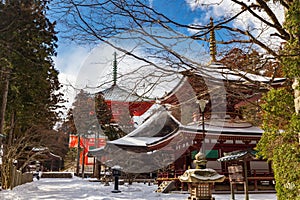 Toto Pagoda in Danjo Garan, Koyasan, covered with snow on a sunny day, Japan