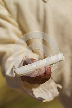 Totora in hand of little boy, Uros