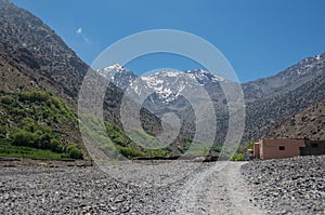 Toubkal national park in springtime with mount, cover by snow an