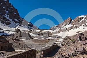 Toubkal national park in springtime with mount, cover by snow an