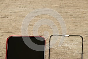 Touch mobile phone and broken tempered glass on an isolated background, glass replacement