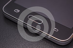 Touch phone black on black background.