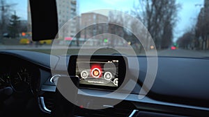 Touch screen in modern sport car interior. GPS navigation and other capabilities and connections