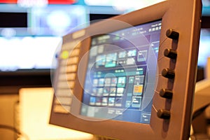 Touch screen monitor of Switcher buttons in studio TV station, A