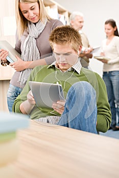 Touch screen tablet computer - students in library