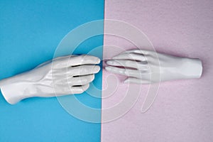 Touching of mannequin hands.