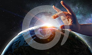 Touching planet with finger