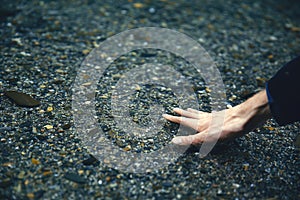 Touching the water. Hand in water. Pure water. Transparent pond. Pond in the mountains. Crystal River