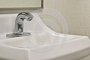 Touchless automated bathroom faucet and sink.