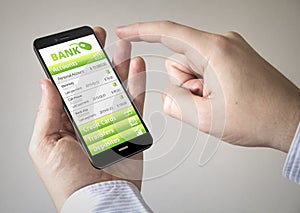 Touchscreen smartphone with online bank application on the scre