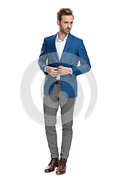 Tough casual man adjusting his buttons