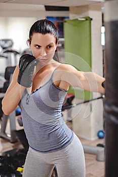 Tough girl punching the bag