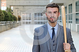 Tough looking male holding baseball bat