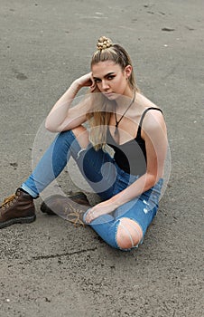 Tough looking teenage girl with her nose pierced