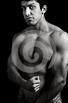 Tough young man with muscular body