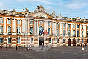 Place du Capitole with long neoclassical facade of Capitole City Hall in Toulouse, France