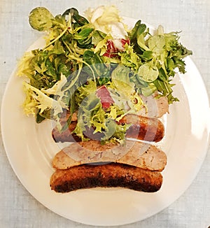Toulouse sausages with salad, French food, French Gastronomy