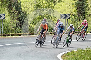 Tour of the Basque Country in Bilbao, Spain. Bike sportler climb the hill with speed