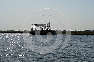 Tour boat in silhoeutte