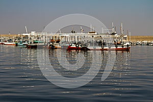 Tour boats docked on the Lake Nasser side of the Aswan High Dam in Egypt