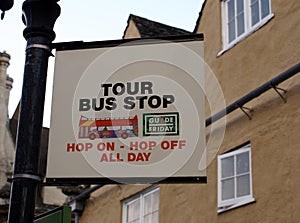 Tour Bus Stop sign. Hop on-hop off all day sign