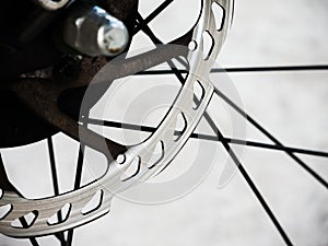 Touring bicycle disc brake at rear wheel in Close up.