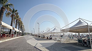 Touris walk pov on promenade seafront photo