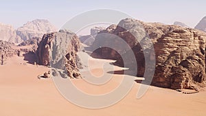 Hiking in the great Umm Rashid Canyon, in Wadi Rum, Jordan. photo