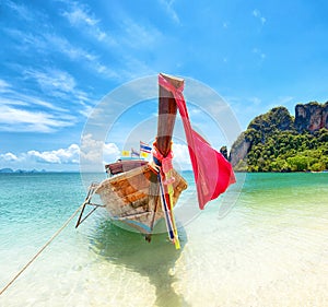 Tourism in Asia. Tropical island and tourist boat on exotic beach