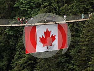 Tourism in Canada: Capilano Suspension Bridge with Canadian Flag