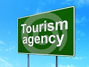 Tourism concept: Tourism Agency on road sign background